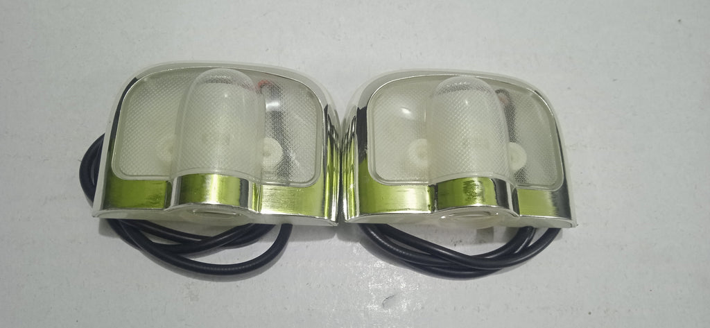 Pair of metallic goggles with clear lenses on a white background