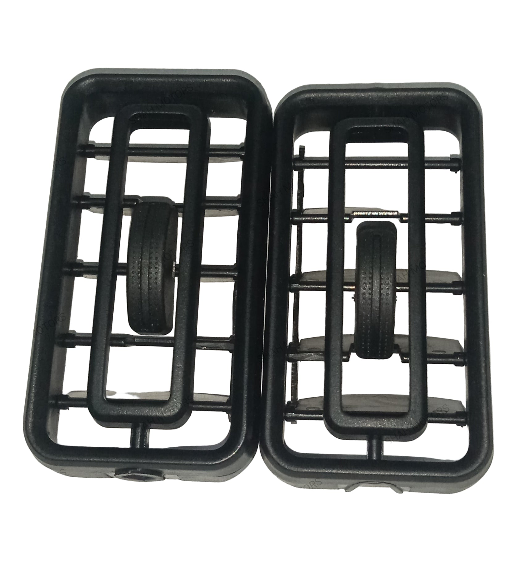 Two black plastic components with wheels on a gray background