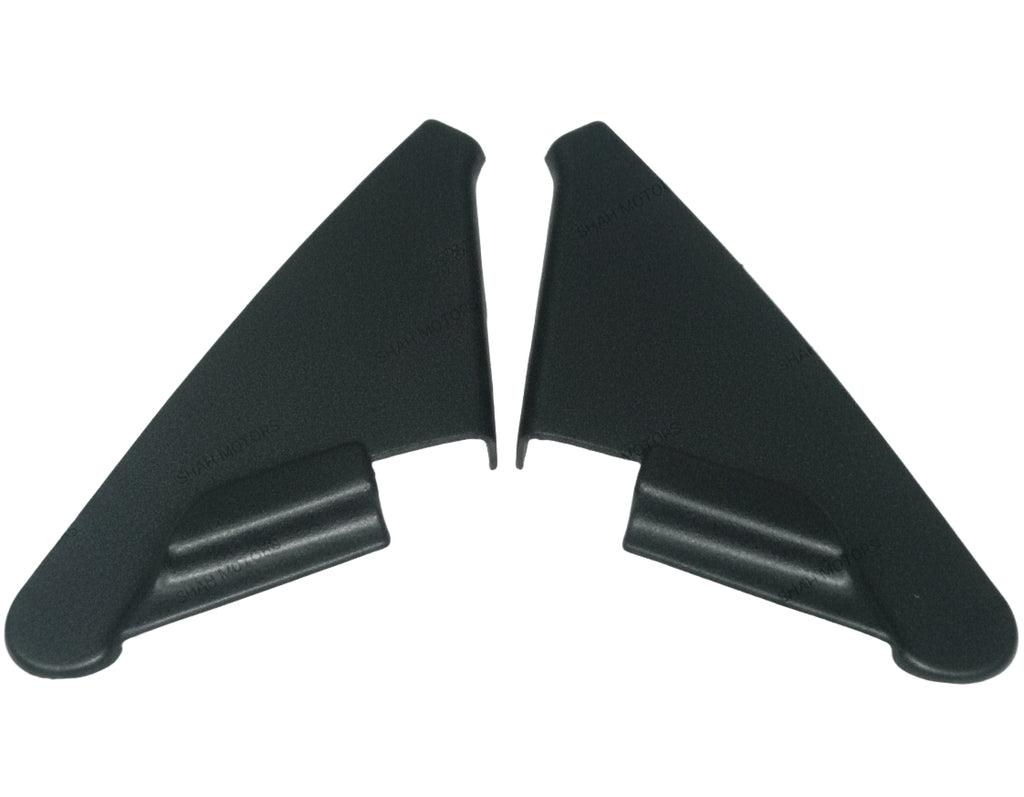 Two black plastic car spoilers on a white background
