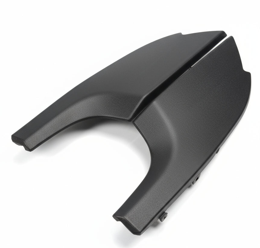 Black plastic car fender on a white background