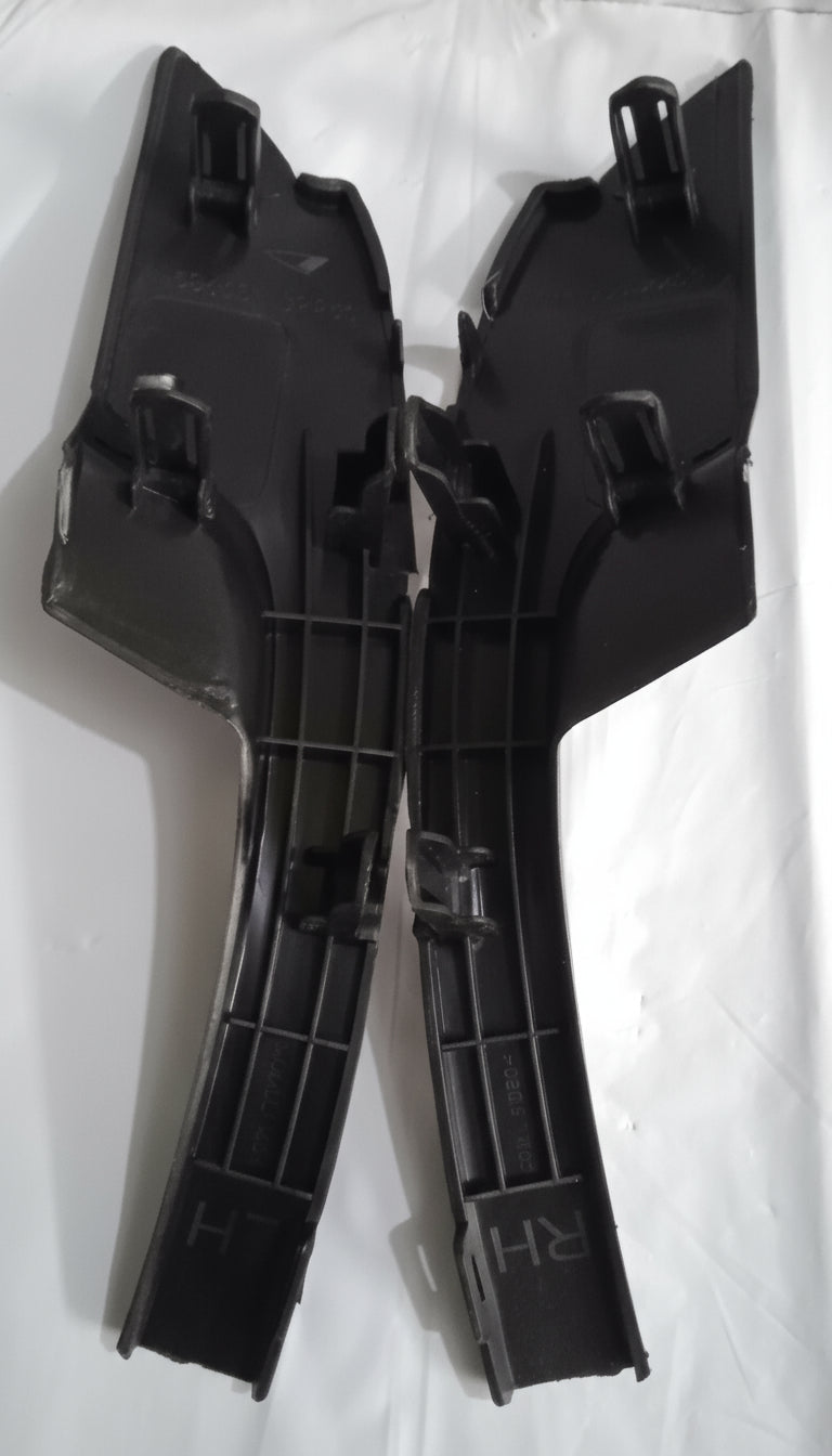 Black plastic components on a white background