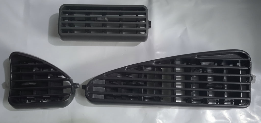 Two black car grilles on a white background