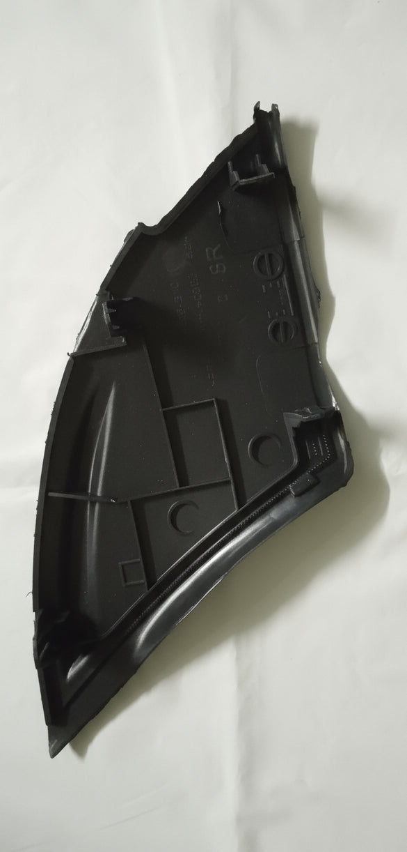 Black plastic car part on a white background