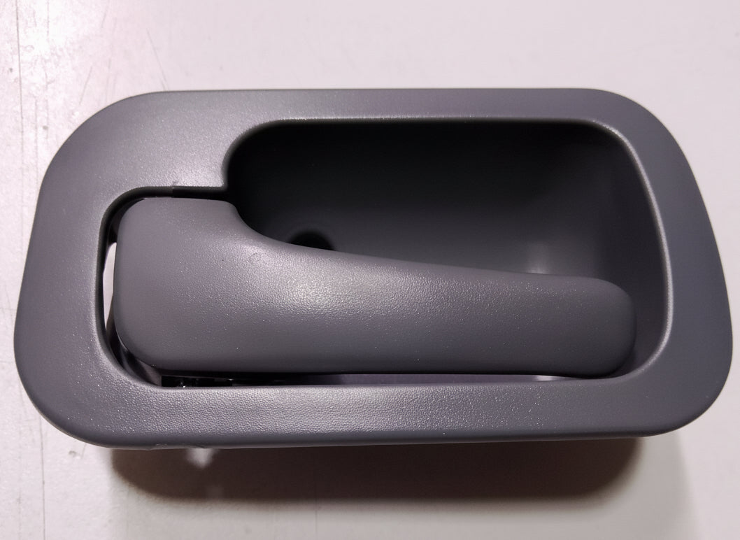 Gray car interior door handle on a white background