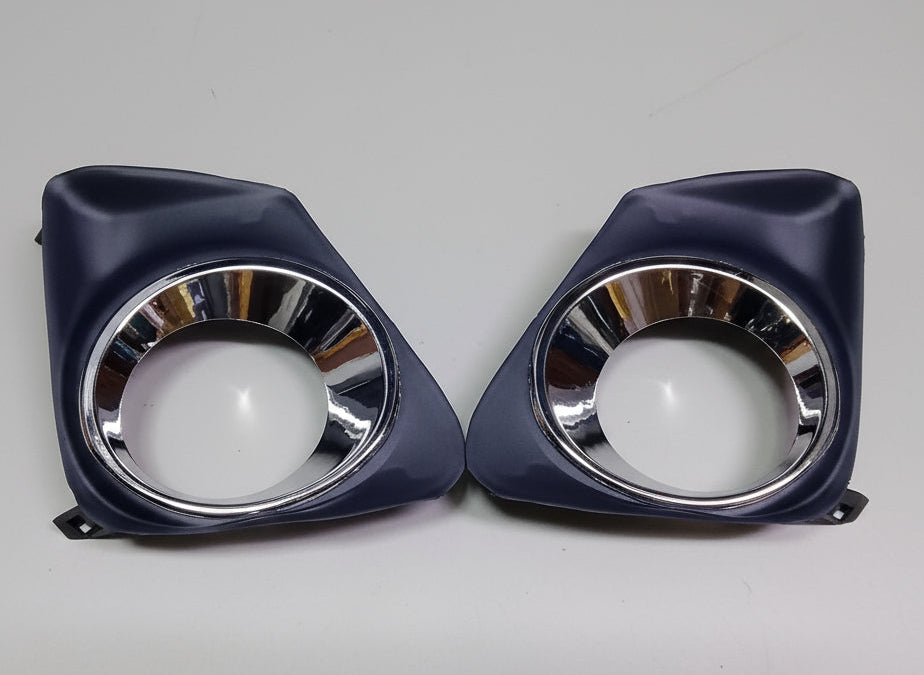 Two pet bowls with silver rims on a marble floor.