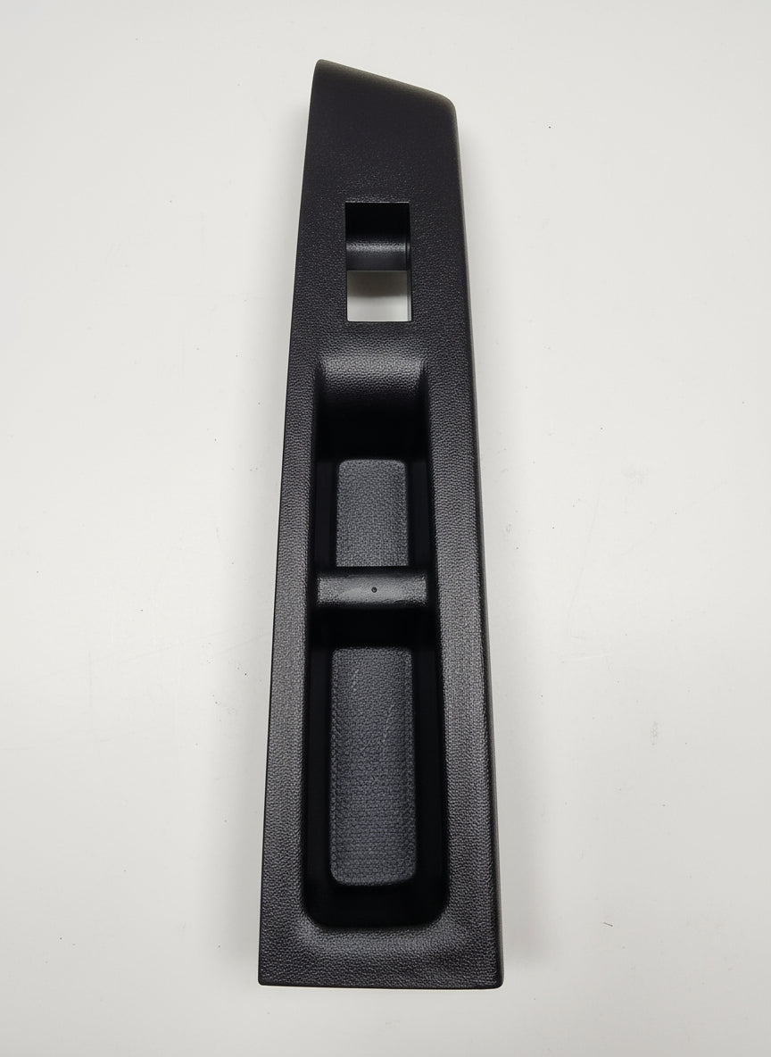 Black car interior panel on a marble floor