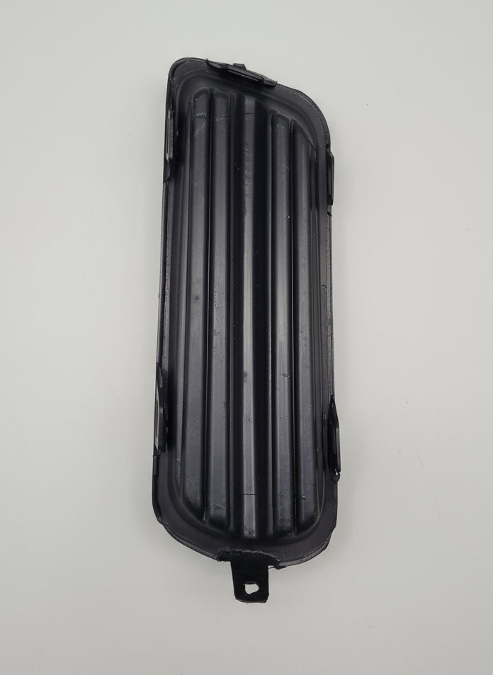 Black metal grille on a gray background