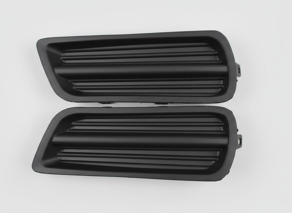 Two black car grilles on a gray background