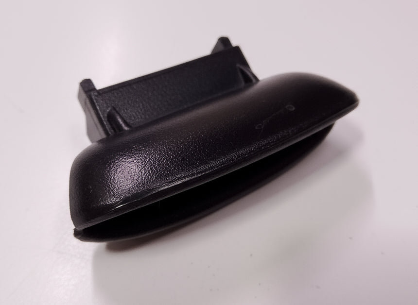 Black car interior door handle on a white background