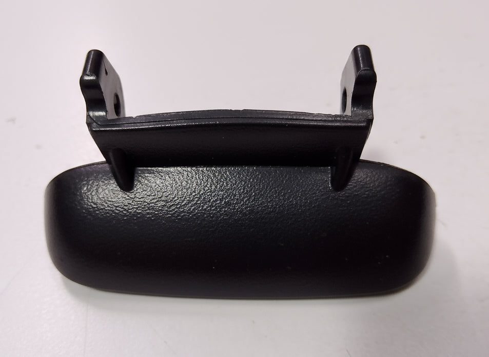 Black plastic component on a white background