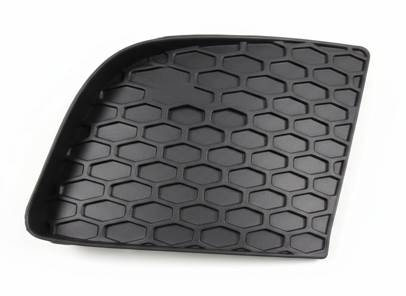 Black honeycomb-patterned mat on a textured surface
