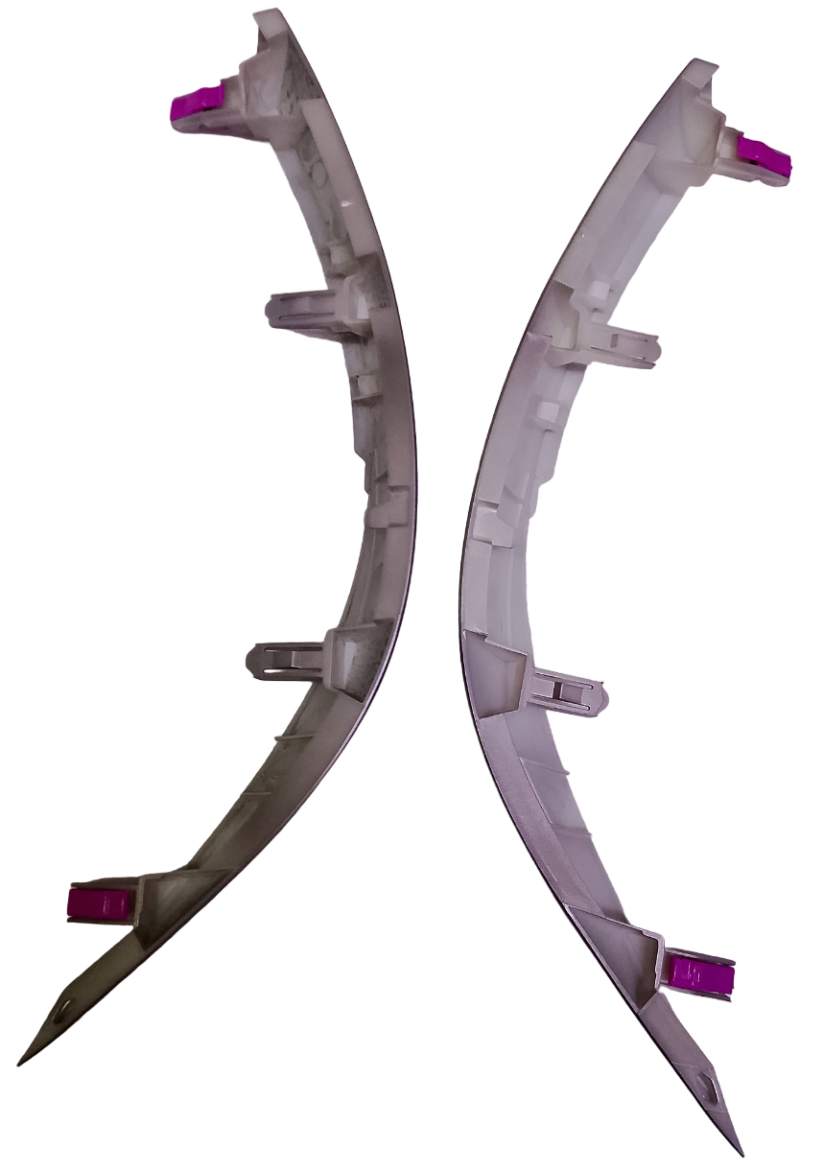 Two metallic car bumper parts on a white background