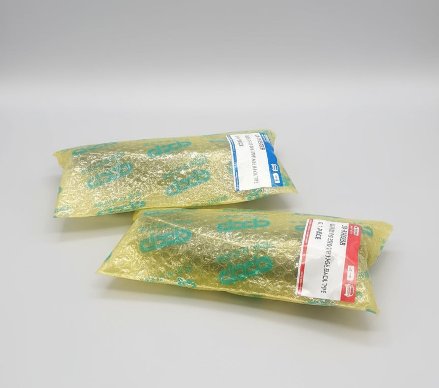 Two packages of 'dcp' brand products on a wooden surface