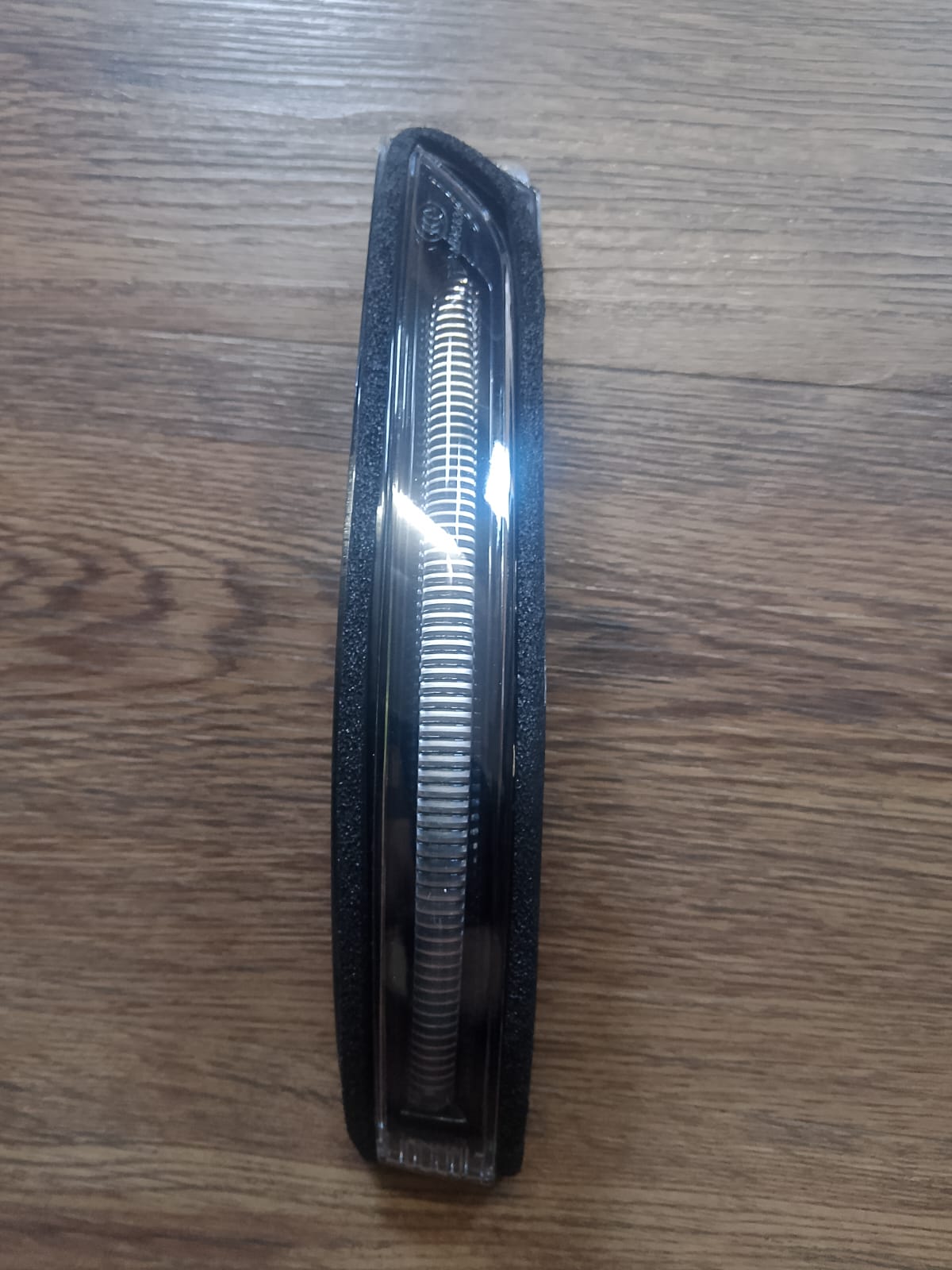 Hair clip with tortoiseshell pattern on a wooden surface