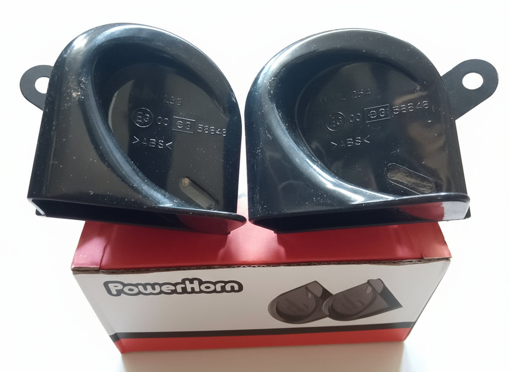 Two black PowerHorn car horns on a cardboard box with visible branding.