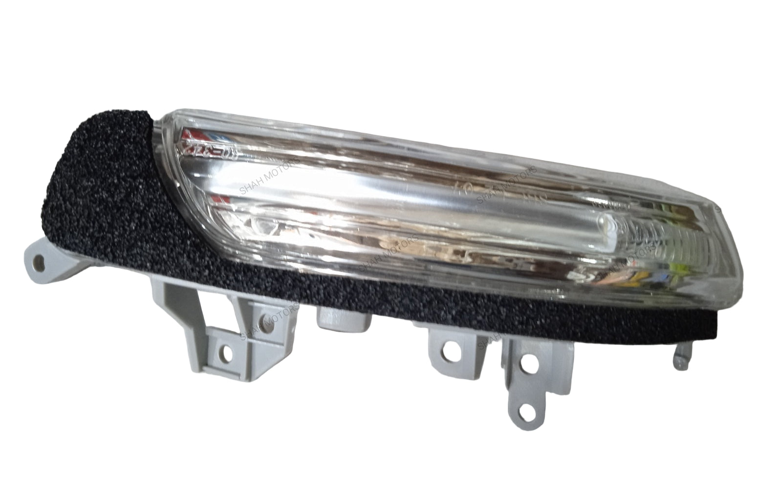 Car fog light on a textured gray background