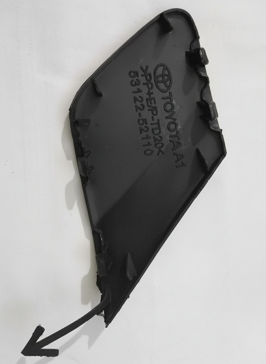 Black car part with Toyota logo on a white background