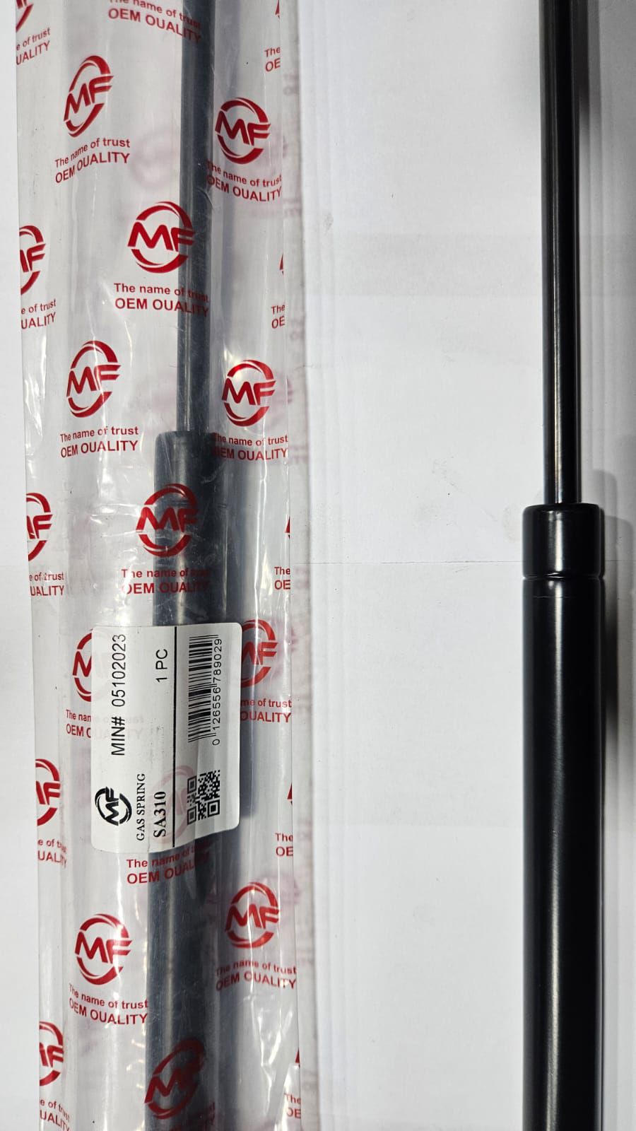 Two car shock absorbers with MZ branding on a white background