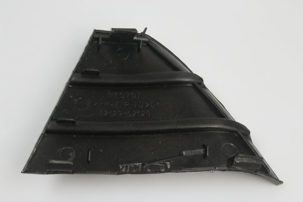 Black plastic automotive part on a light gray background
