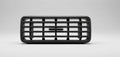 Black car grille on a white surface with a gray textured background