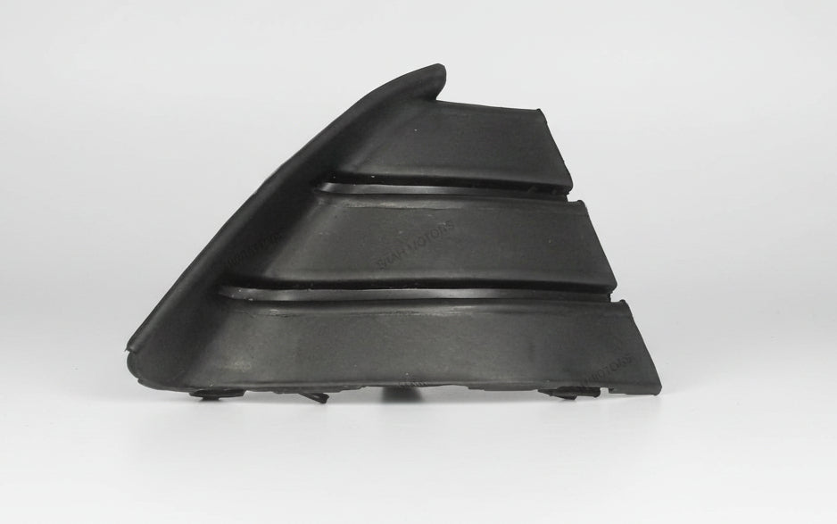Black plastic car part on a light gray background