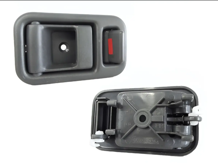 Two car interior door handles on a white background