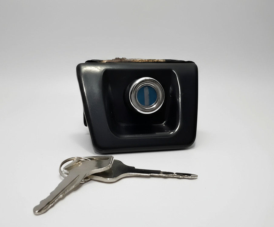 Black car key fob with two keys on a white background