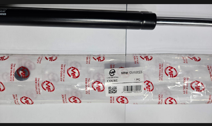 Packaged automotive shock absorber on a white background