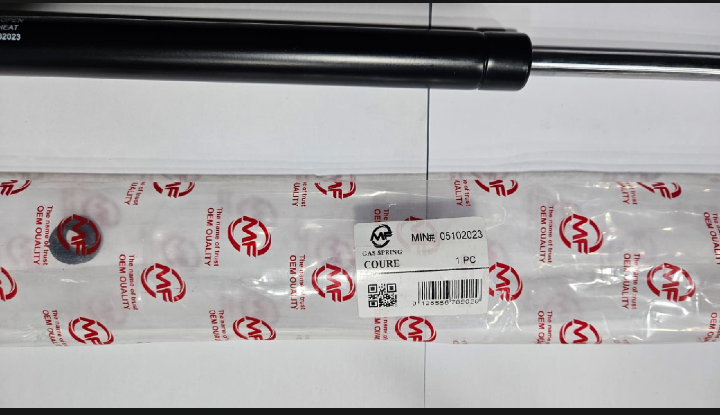 Packaged automotive shock absorber on a white background
