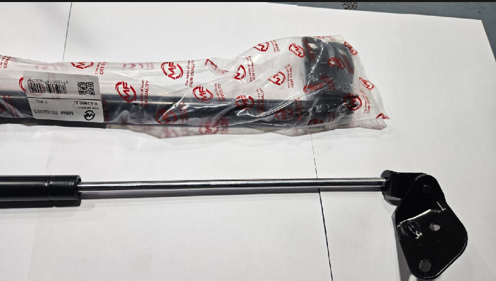 Black tool with packaging on a white surface