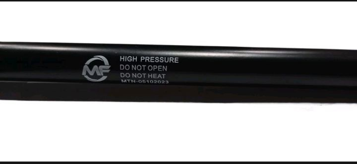 Black high-pressure hose with visible branding on a white background