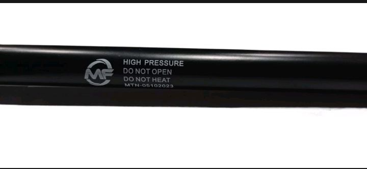 Black high-pressure hose with visible branding on a white background
