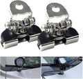 Two metal clamps with additional components on a white background, with two smaller images showing their use on car windshields.