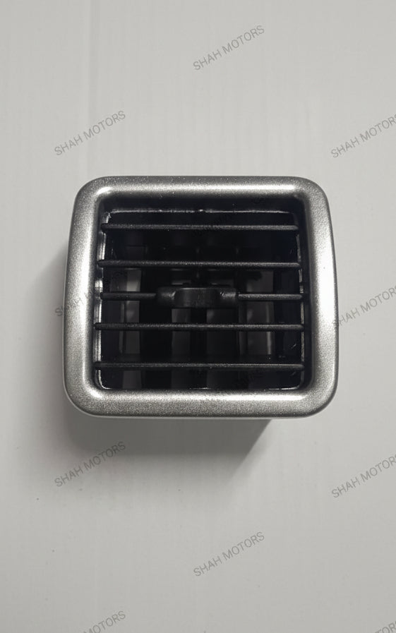 Car air vent with metallic frame on a white background