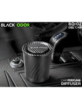 Car perfume diffuser with 'Black Odor' branding on a car dashboard.