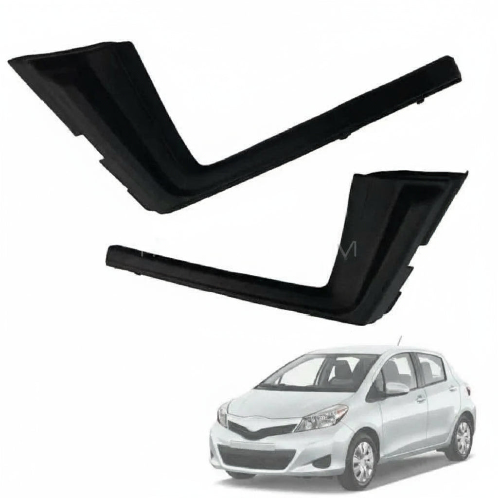 Two black car air vent covers with a white car in the background.