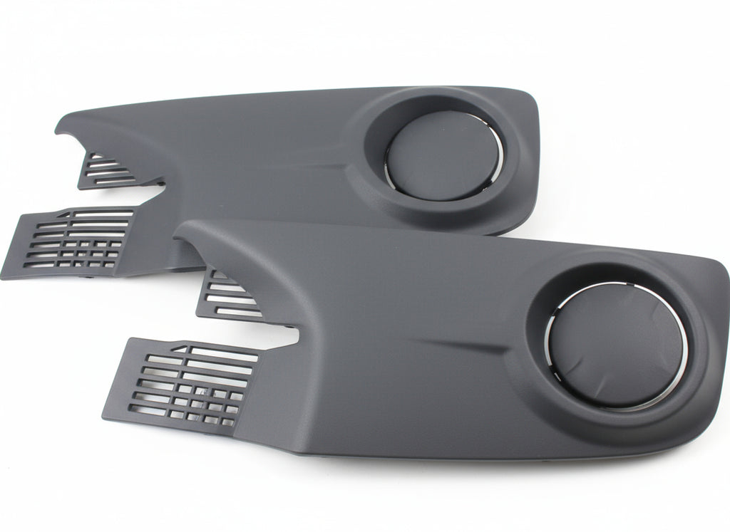 Two gray plastic parts with circular cutouts on a textured surface
