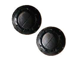 Two black circular objects on a brown surface