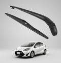 Two car wipers with a white car in the background