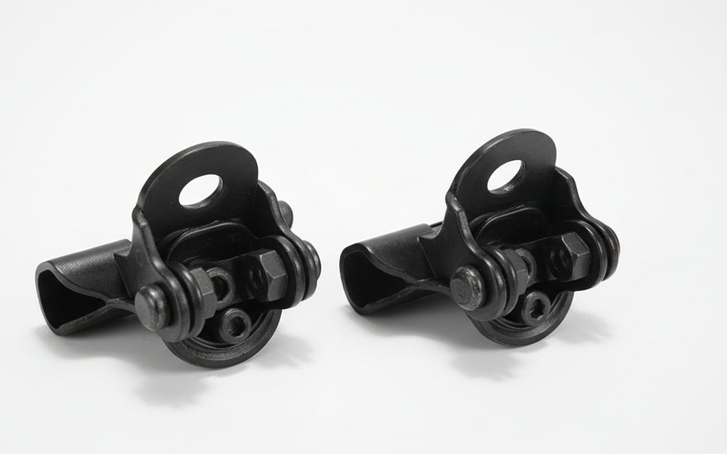 Two black metal clamps on a white background
