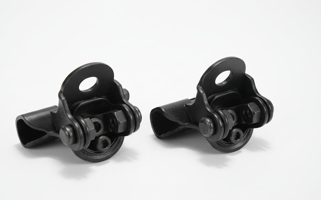 Two black metal clamps on a white background