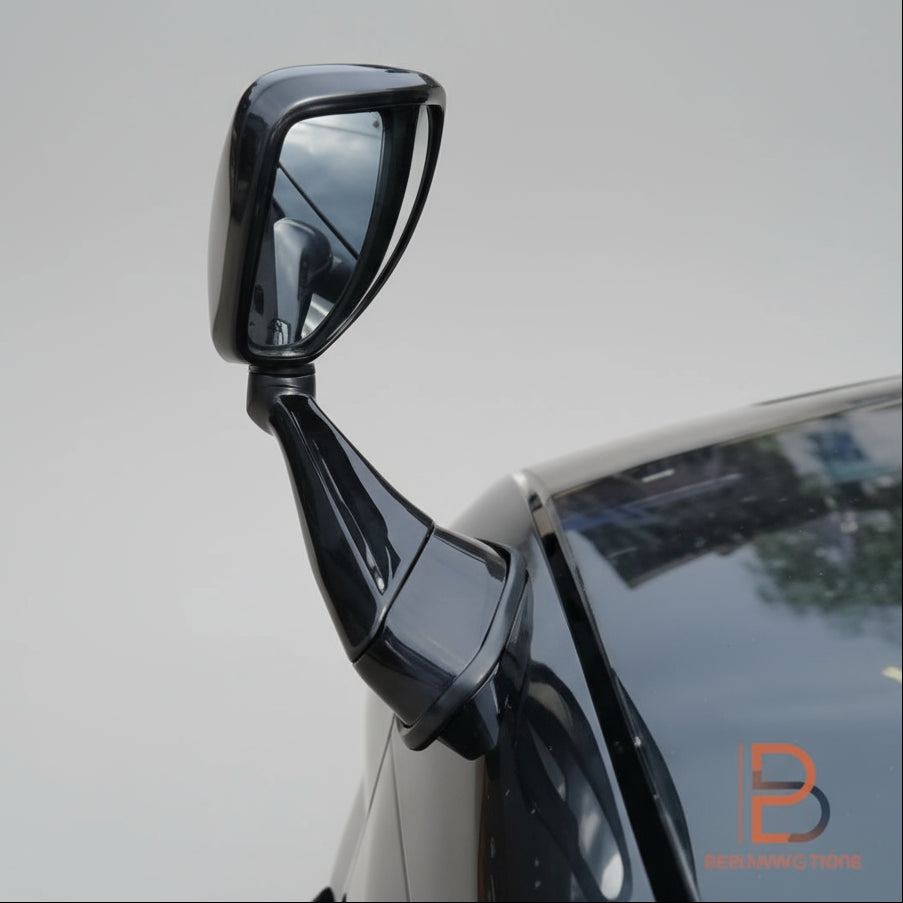 Car side mirror on a vehicle with a street background