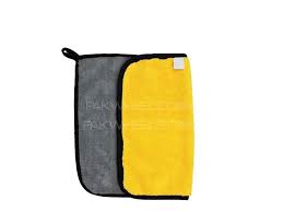 Gray and yellow towel with a black strap on a white background