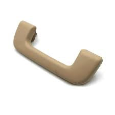 Beige car door handle on a white background