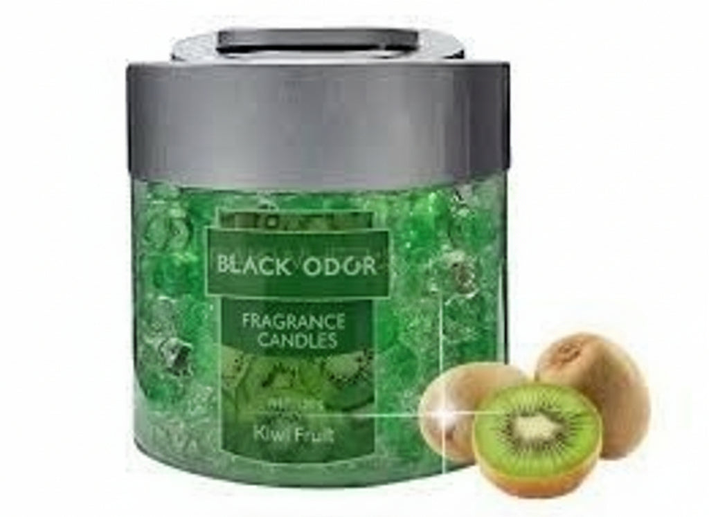 Green jar of Black Odar fragrance spheres with kiwi fruits on a white background