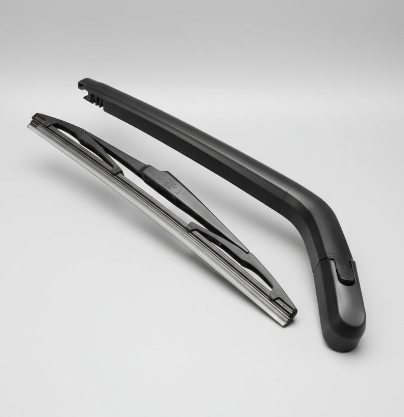 Two car wiper blades on a light gray background