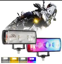 Motorcycle with additional lights and colorful LED lights on a white background