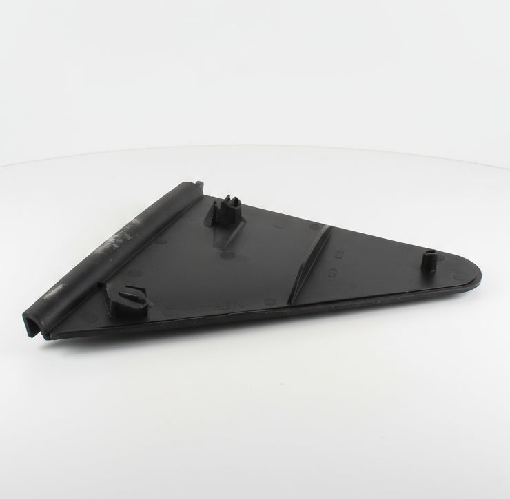 Black plastic component on a textured gray surface