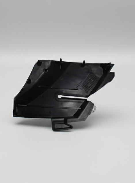 Black plastic component on a white background