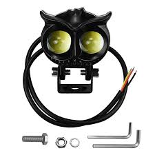 Owl-shaped light fixture with wiring and tools on a white background
